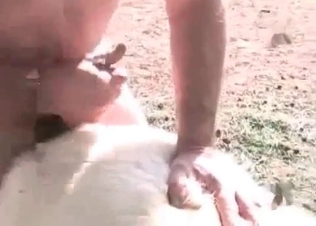 Asian is playing with her doggy's big balls