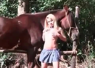 Farm girl is blowing a horse