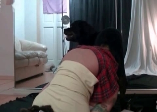 Tattooed schoogirl and her doggy