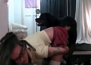 Tattooed schoogirl and her doggy
