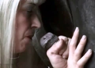 Bleached mommy is blowing a horse cock