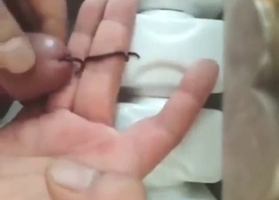 Worm crawling up this dude's penis big time
